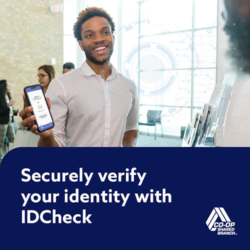 Man standing with phone in hand showing screen to another person. Securly verify your identity with IDCheck